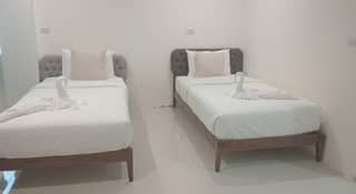 เตียงภายในห้อง Family Room - Zayn Hotel สมุย